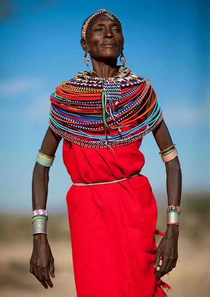 Orange tribal outfit on location in Kenya for “Up the Sandbox.”